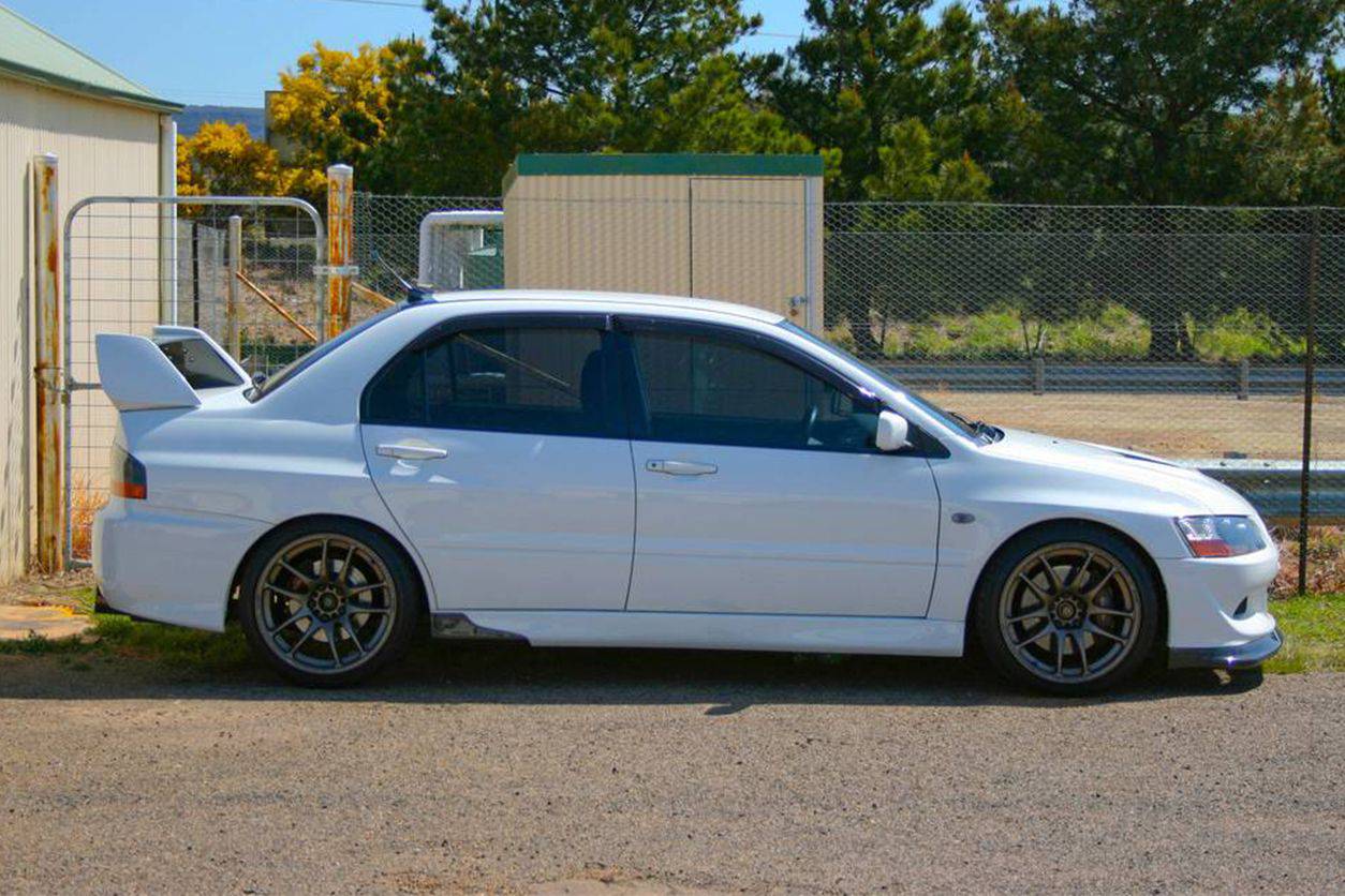 2003-2006 Mitsubishi Evolution 7/8/9 RX Style Carbon Fiber Spliter - Carbonado
