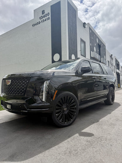 Installation example: Cadillac Escalade 24-inch Giovanna Trento Gloss Black. Wheel size and vehicle setup may differ from this set.